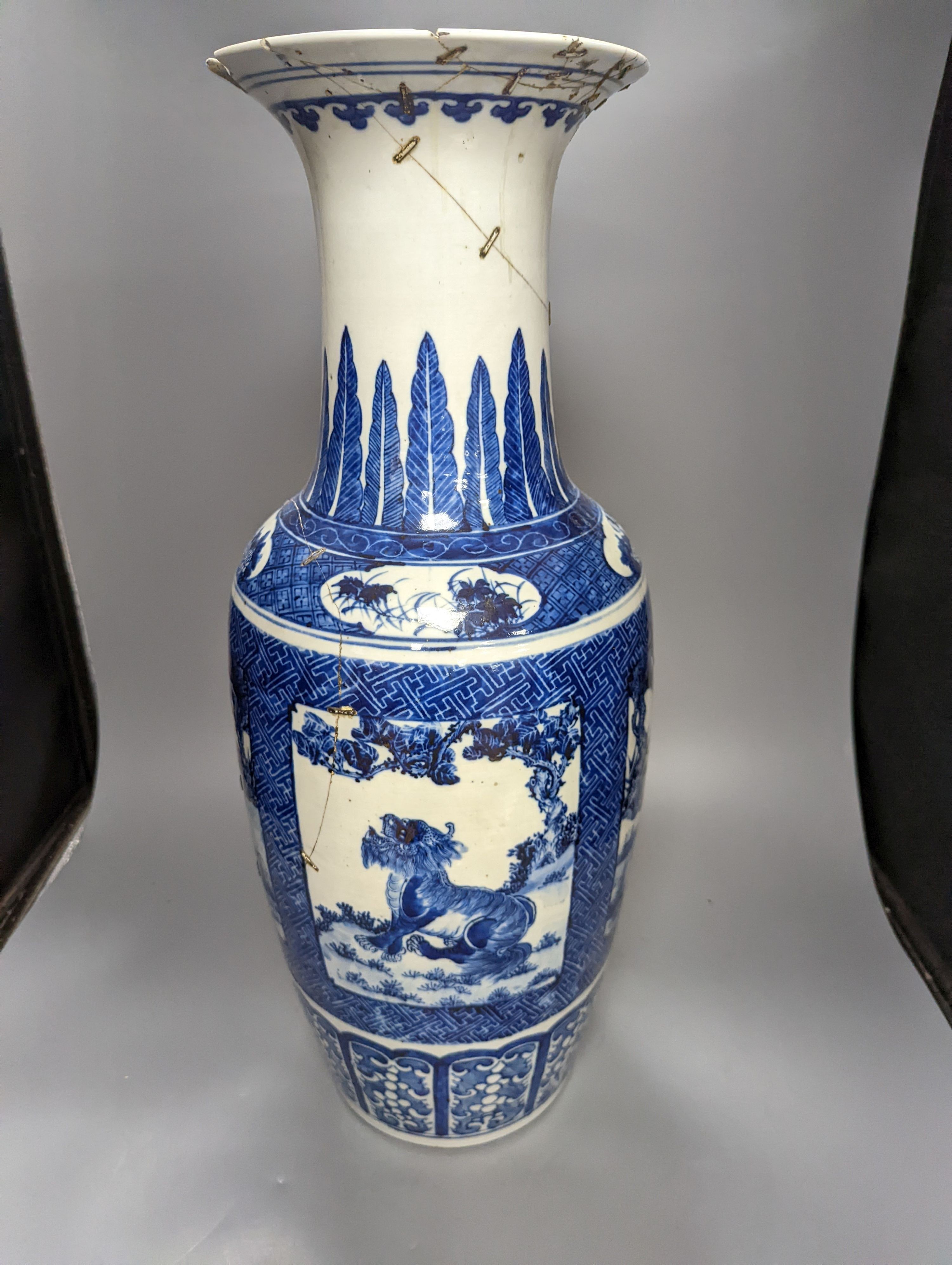 A pair of large early 20th century Chinese Blue and white ‘mythical beast’ vases, 60 cms high.